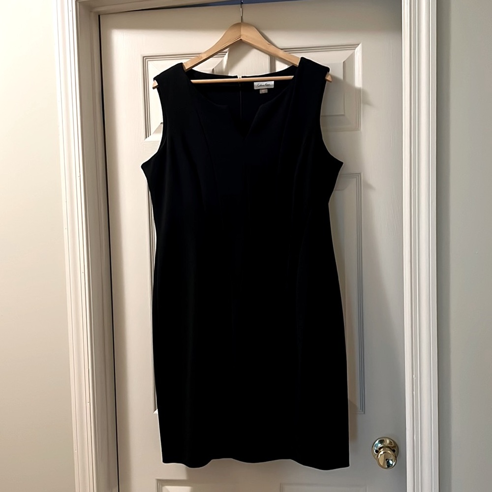 Black Calvin Klein sleeveless dress with vertical slenderizing seeming!